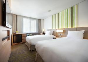 Holiday Inn Resort Shinano-Omachi Kuroyon by IHG客房内的一张或多张床位
