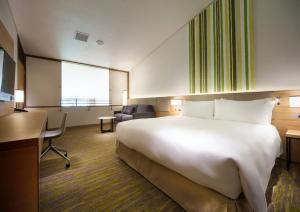 Holiday Inn Resort Shinano-Omachi Kuroyon by IHG客房内的一张或多张床位