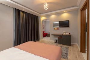 Кровать или кровати в номере Toprak Apart Otel