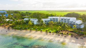 an aerial view of a resort with a beach and the ocean at Victoria Beachcomber Resort & Spa - Victoria for 2 - Adults Only in Pointe aux Piments