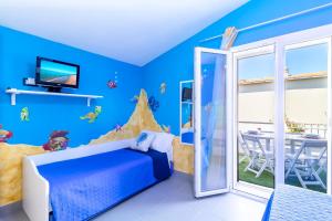 Postel nebo postele na pokoji v ubytování Sunset Bay Tecno Home Sardinia