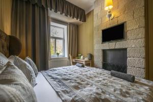 Ένα ή περισσότερα κρεβάτια σε δωμάτιο στο Oxigén Family Hotel Noszvaj