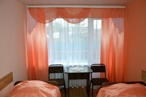 a room with a window with a table at Готель Профспілковий in Vinnytsya