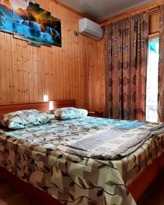 Krevet ili kreveti u jedinici u okviru objekta Гостевой дом у Ларисы