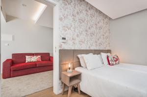 Postel nebo postele na pokoji v ubytování Essence Inn Marianos Hotel