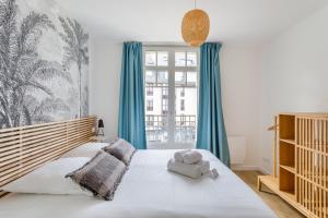 Cama ou camas em um quarto em Résidence MALO'INN - au cœur de Saint Malo