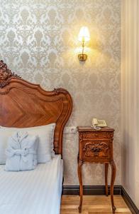 
A bed or beds in a room at Saint Feder Boutique Hotel
