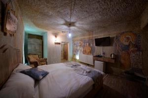 Кровать или кровати в номере Adelya Cave Hotel