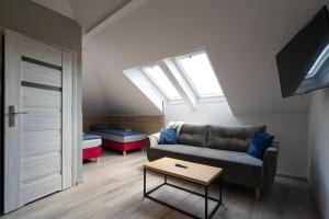 Posedenie v ubytovaní City Center Apartments Lofty z klimatyzacją