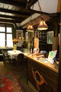 a dining room with a table and two lights at Hotel zur Post in Bacharach