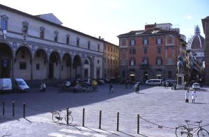 a city square with buildings and bikes on a street at Hotel Le Due Fontane in Florence