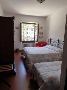Posteľ alebo postele v izbe v ubytovaní Albergo Giovanni Da Verrazzano