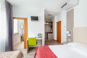 Postel nebo postele na pokoji v ubytování Hotel Venezia + 37 fotografií