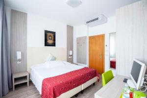 Postel nebo postele na pokoji v ubytování Hotel Venezia