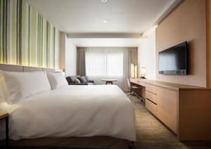 Holiday Inn Resort Shinano-Omachi Kuroyon by IHG客房内的一张或多张床位