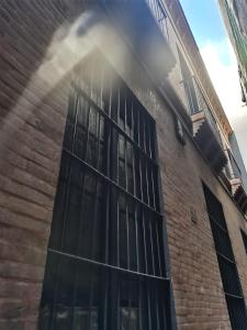 a building with a window with steam coming out of it at FERIA MODERN y LUXURY in Seville