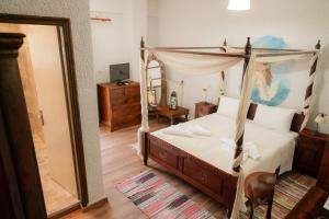Posteľ alebo postele v izbe v ubytovaní Akrotiri B&B