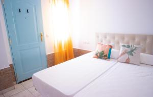 Postel nebo postele na pokoji v ubytování Salitre Rooms