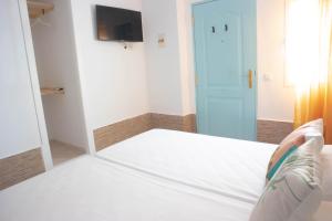 Postel nebo postele na pokoji v ubytování Salitre Rooms
