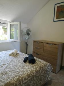 Postel nebo postele na pokoji v ubytování Apartman Kosta