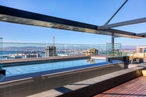 a swimming pool on the roof of a building with a view at Always-Power Luxury Sky Retreat in Cape Town