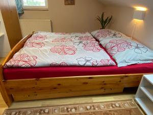 a bed with two pillows on it in a room at Fured Apartments in Balatonfüred