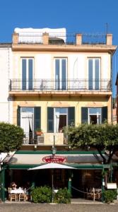 a large building with a table in front of it at Albergo Nazionale in Portofino