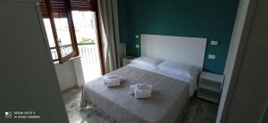 Postel nebo postele na pokoji v ubytování AD UN PASSO DAL MARE