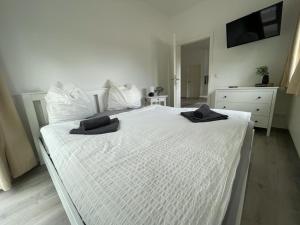 Ένα ή περισσότερα κρεβάτια σε δωμάτιο στο Quartier am Haff