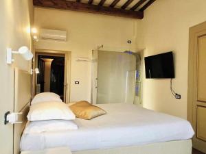 Postel nebo postele na pokoji v ubytování Mavitur Rooms Assisi