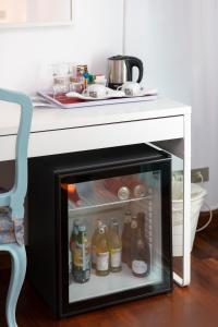 an open refrigerator with drinks in it in a kitchen at Albergo Nazionale in Portofino