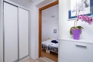 Ein Bett oder Betten in einem Zimmer der Unterkunft Apartments Katica