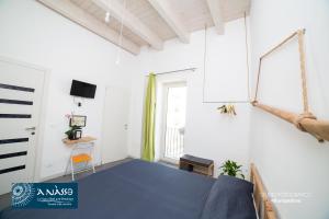 Μια τηλεόραση ή/και κέντρο ψυχαγωγίας στο Bed & breakfast La Nassa +38 φωτογραφίες