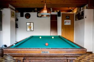 a pool table with a ball on top of it at Hotel Huberty Kautenbach in Kautenbach