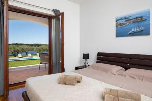 Postel nebo postele na pokoji v ubytování Villa Zuccon + 37 fotografií