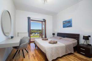 Postel nebo postele na pokoji v ubytování Villa Zuccon