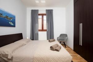 Postel nebo postele na pokoji v ubytování Villa Zuccon