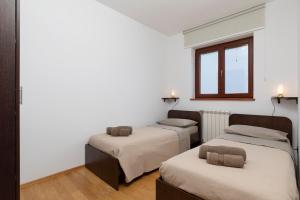 Postel nebo postele na pokoji v ubytování Villa Zuccon