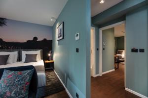 Giường trong phòng chung tại Camera Hotel