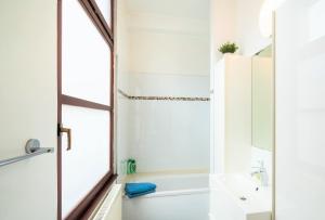 a bathroom with a shower and a sink at The Antwerp Old Town Lodge in Antwerp