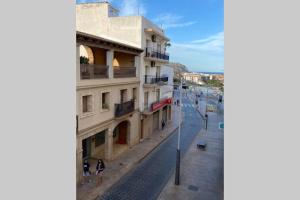 a view of a street with people walking on the sidewalk at CASABLANCA in Jávea