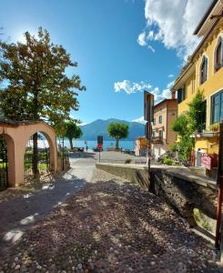 a street in a town with a view of the water at L'angolo di Giulia in Castelletto di Brenzone
