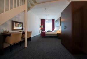 Hotel Arcen tesisinde bir odada yatak veya yataklar