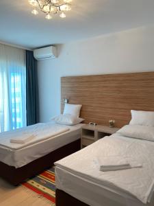 Postel nebo postele na pokoji v ubytování RIA Lungomare