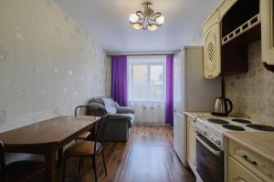 a kitchen with a table and a dining room at ОК! Советская, 69 №5 in Tomsk