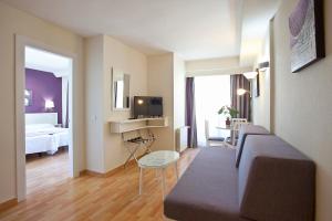 a hotel room with a couch and a bedroom at Ona Princesa Playa in Marbella