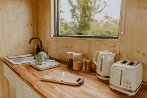 Η κουζίνα ή μικρή κουζίνα στο Parcel Tiny House I Ferme de Garance