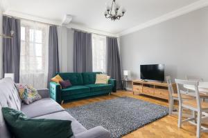 TV a/nebo společenská místnost v ubytování Jezuicka Old Town Pleasant Apartment