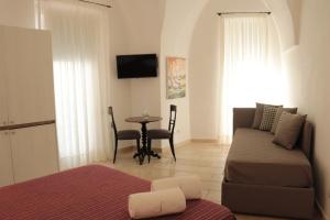 a living room with a couch and a table at B&B Salentus in Gallipoli