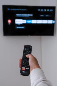 A television and/or entertainment centre at B&B Palazzo Storico Di Nicola